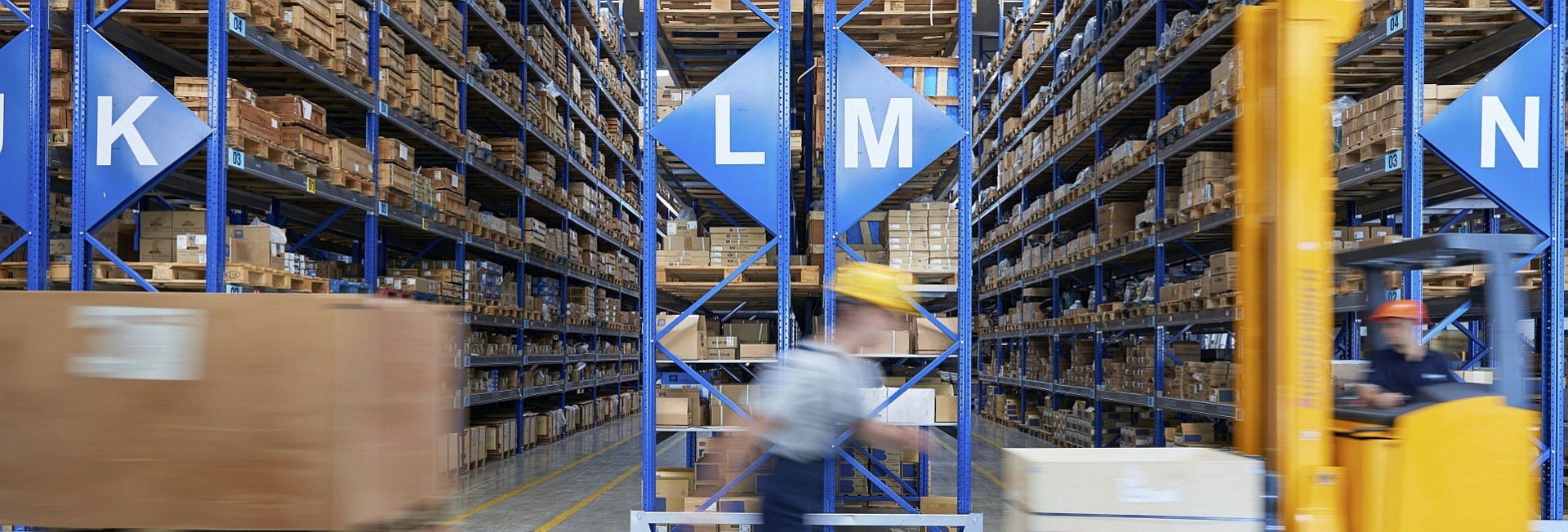 Cardboard boxes on shelves in warehouse. Storhouse.